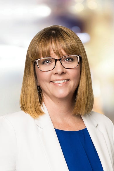 Portrait of Dotti Burdsall, Office Administrator & Client Care Coordinator.